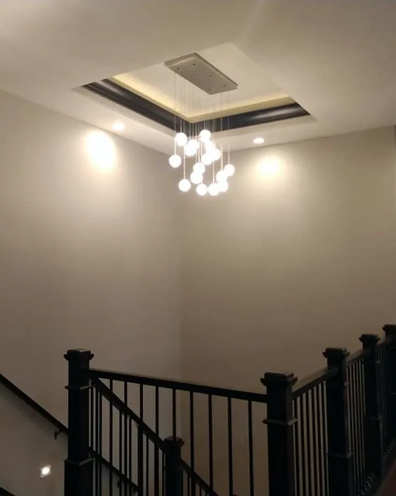Two-story entry with tray ceiling and dark railing, painted by Full Spectrum Painting