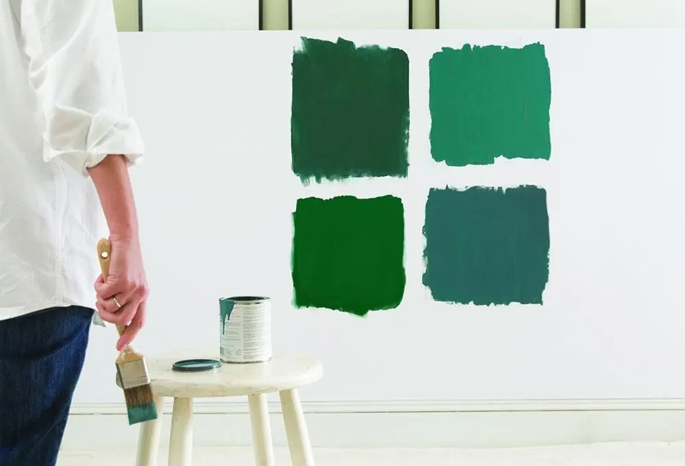 Testing paint swatches on a wall